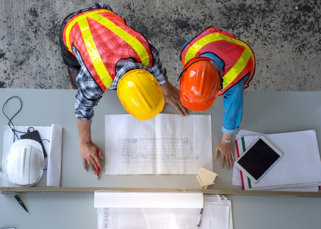 Aerial view of two construction engineers working on a project